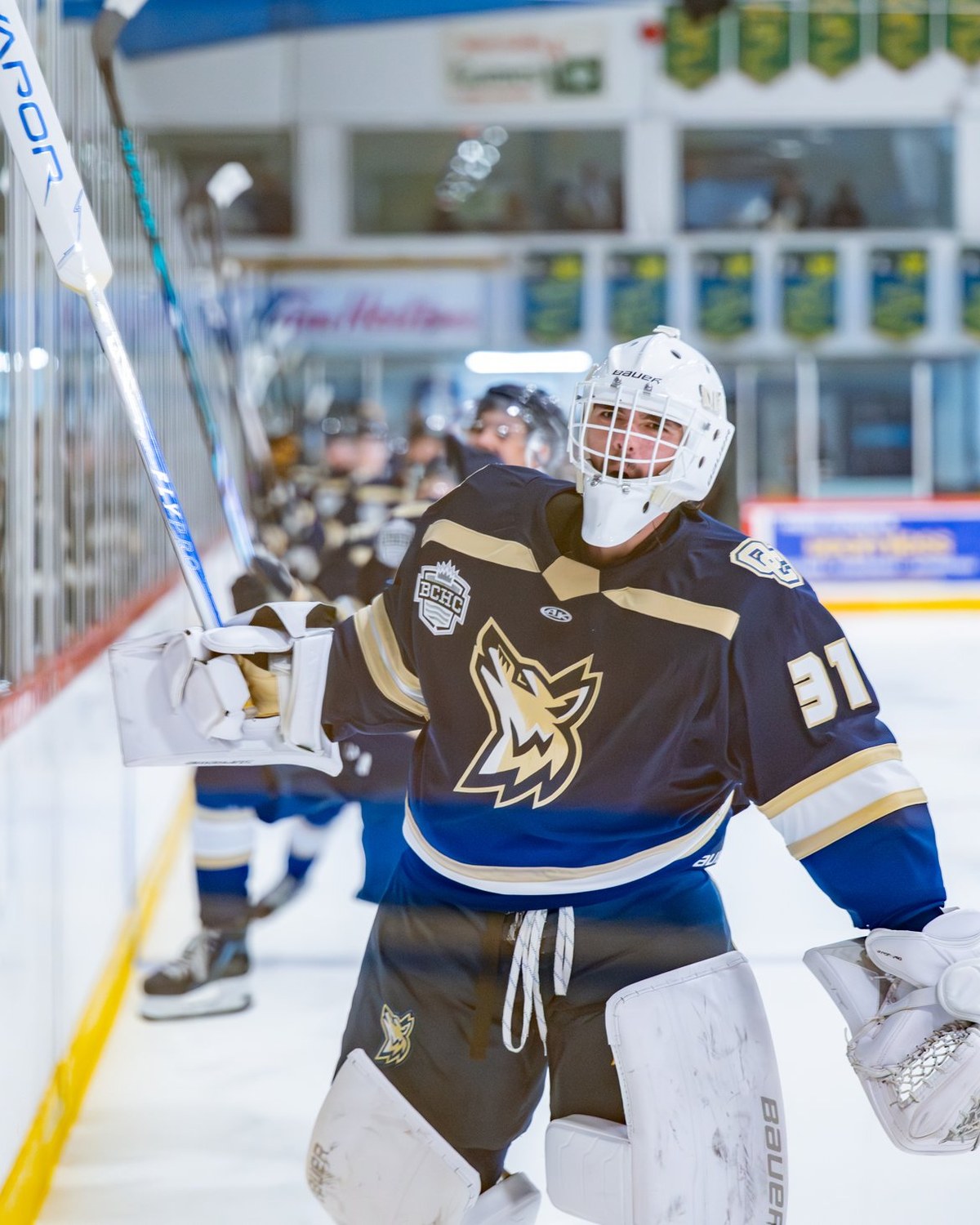 Coyotes goalie celebrating with teammates